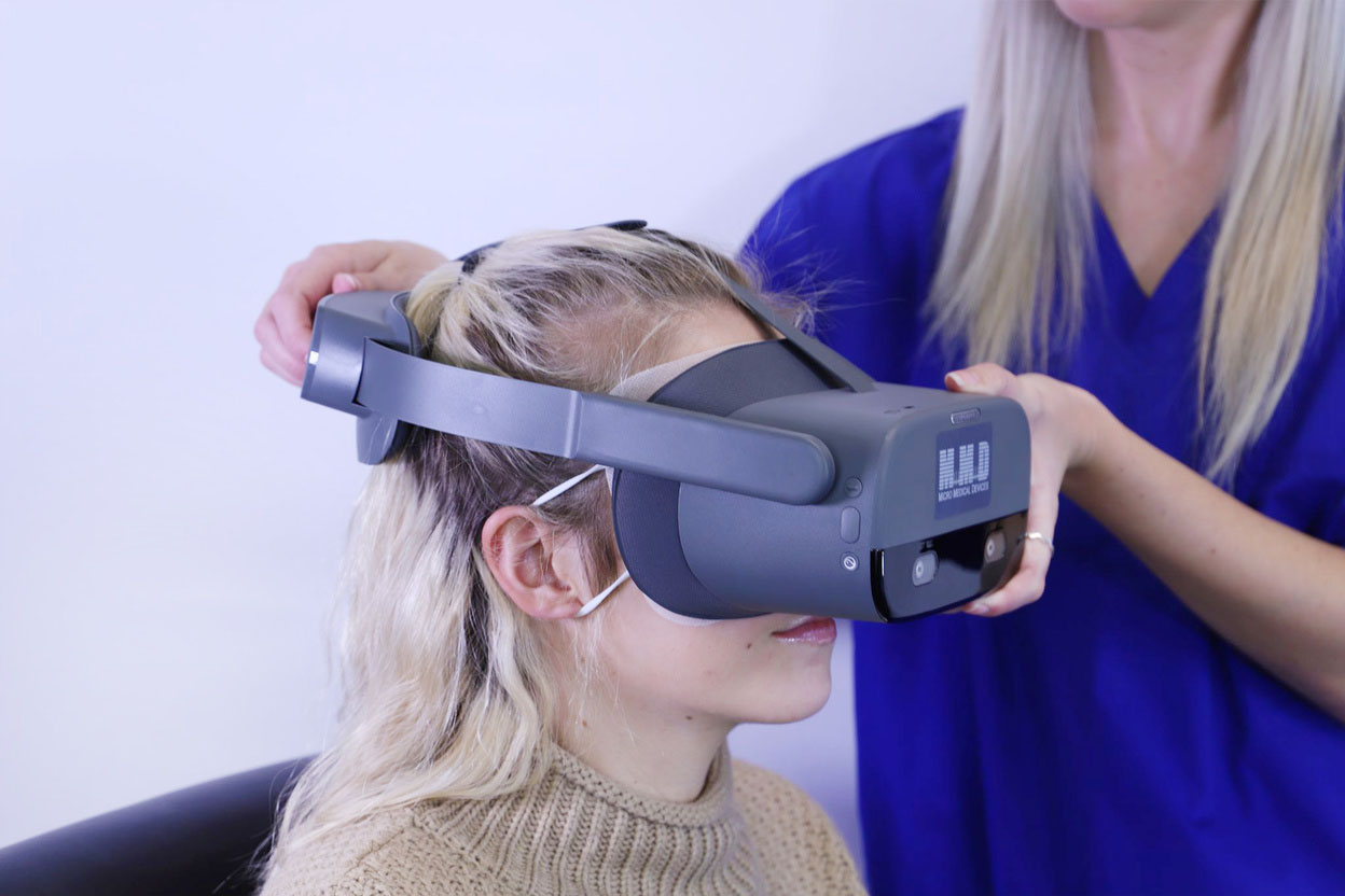 Patient receiving vision test with the VF2000 NEO virtual reality visual field device