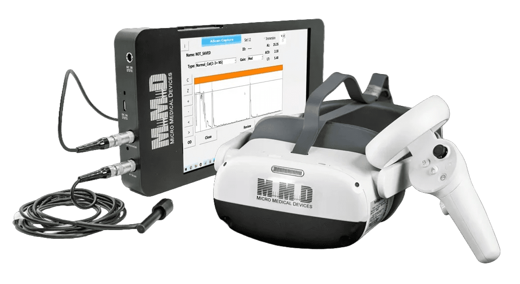 A diagnostic device including a touchscreen monitor displaying a medical graph, two connected cables, a VR headset labeled Micro Medical Devices, and a handheld controller.